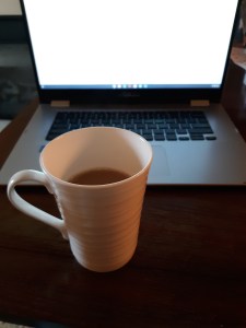 mug of coffee and a laptop